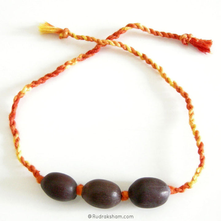 Wholesale Pack of 10 - Lotus Seed Beads and Moli Band | Black Kamal Gatta Beads Band with Mauli Thread ( Kalawa ) | Sacred Hindu Pooja Thread with Lotus Beads to make a Wrist Bracelet